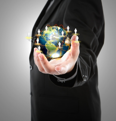 Business Man Holding Small World in his hands- Image courtesy of jannoon028-freedigitalphotos.net .jpg