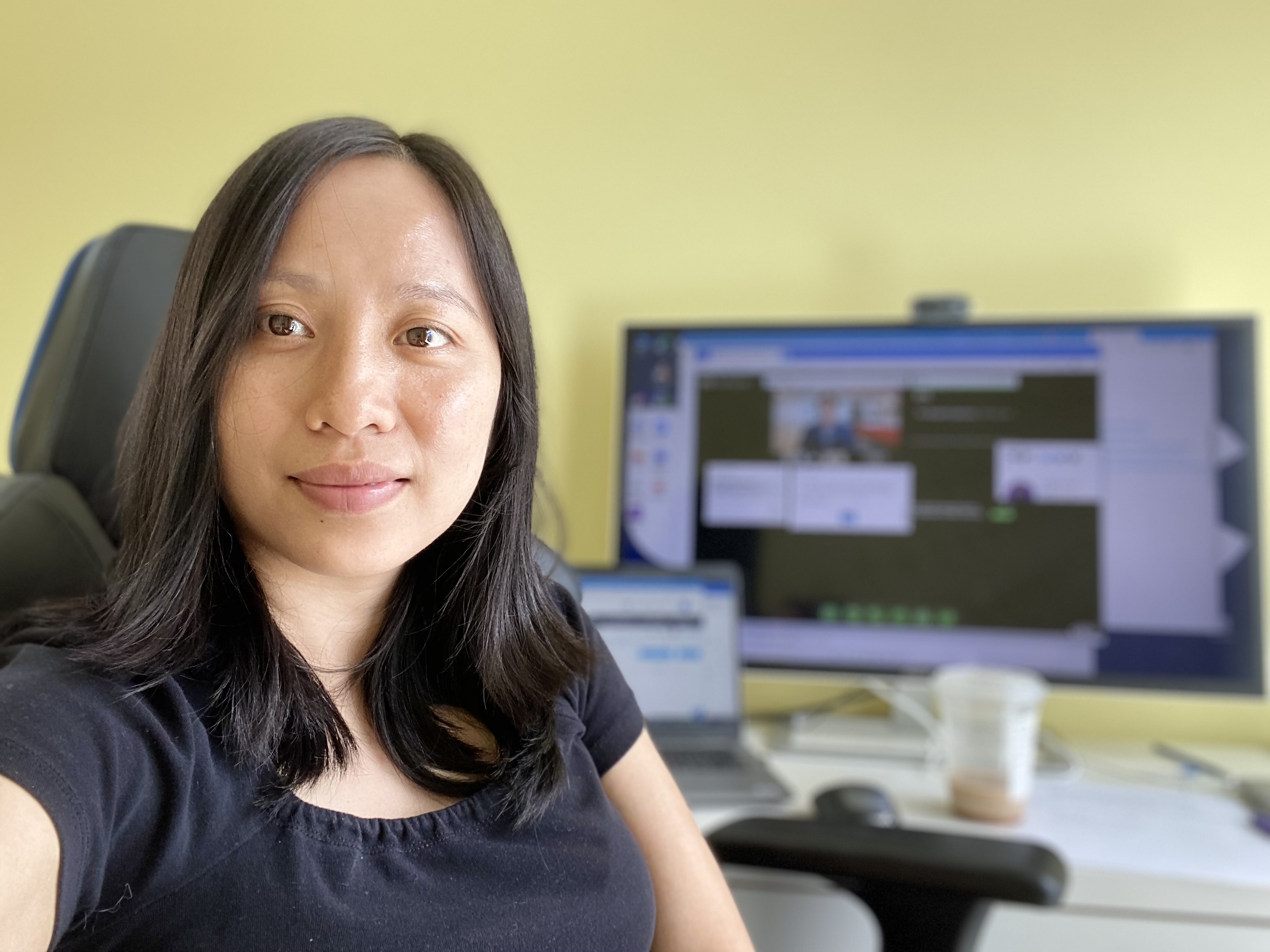 This is a photo of me in front of desk in my home office.